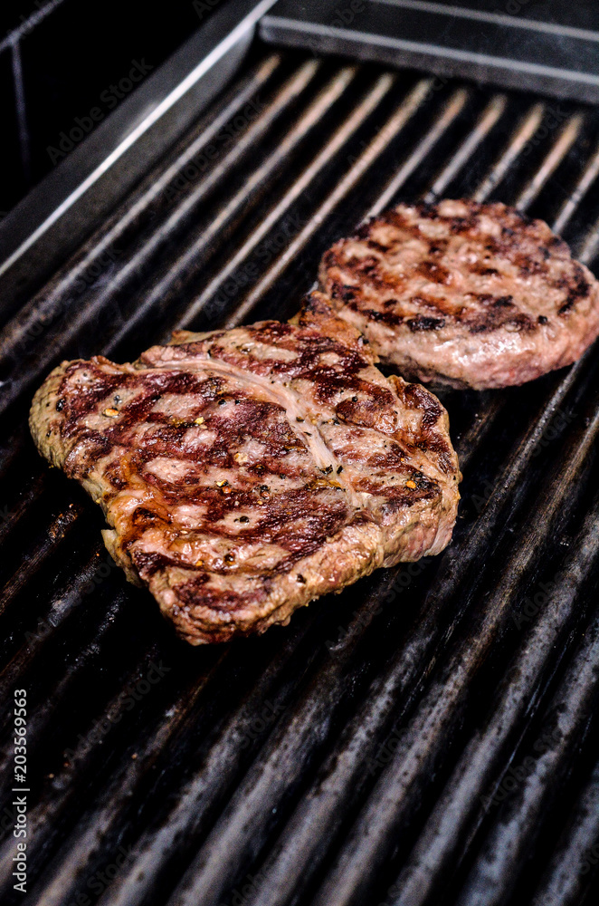 Group grilled ribeye beef steaks on the grill outdoor, background. barbecue season concept, bbq copy space, summer Group grilled ribeye beef steaks on the grill outdoor, background. barbecue season concept, bbq copy space, summer