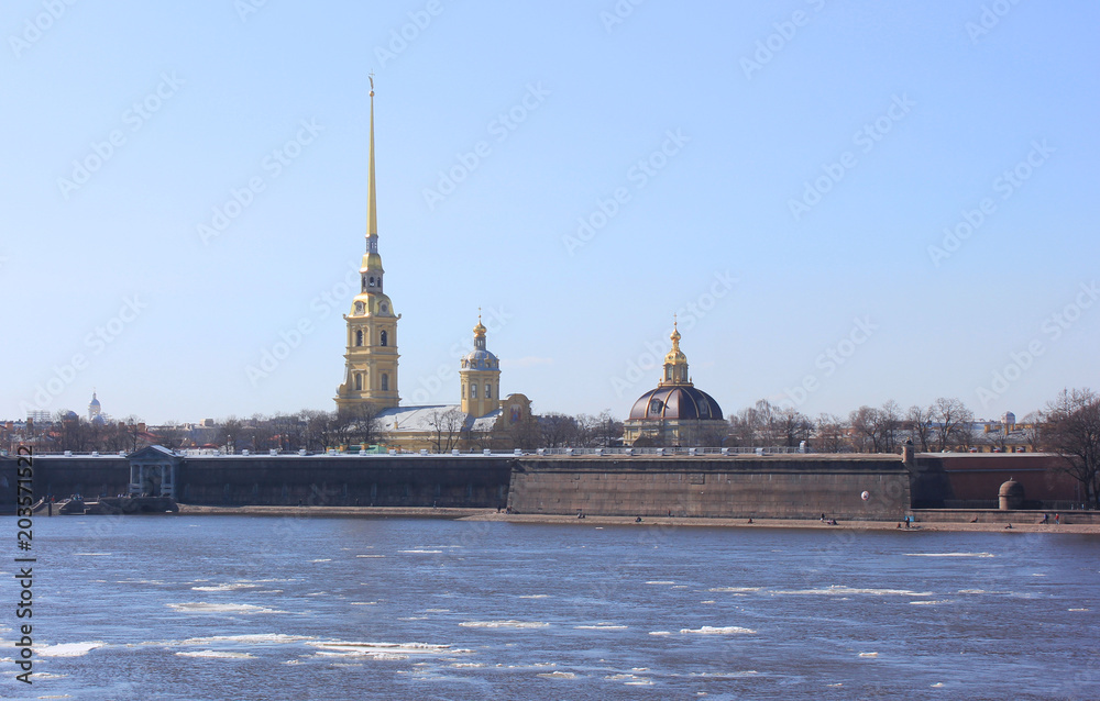 Peter and Paul Fortress View in St. Petersburg, Russia. Original Citadel of the City, Founded by Peter the Great in 1703. Winter Scene Wallpaper of Popular Travel Sight across Neva River Water.