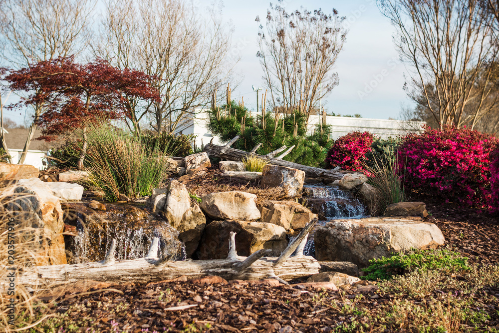A cozy place with an artificial waterfall in the park. Spartanburg. South Carolina. USA A cozy place with an artificial waterfall in the park. Spartanburg. South Carolina. USA