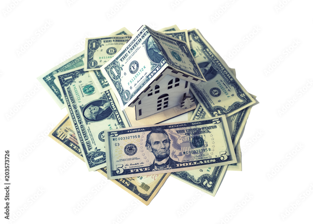 isolate house model on dollar cash stack closeup isolate house model on dollar cash stack closeup