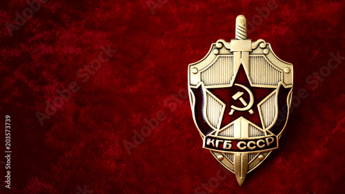 Obraz na płótnie Secret service, intelligence agency, and espionage concept with cold war era KGB badge from the former USSR, on red background with copy space w salonie