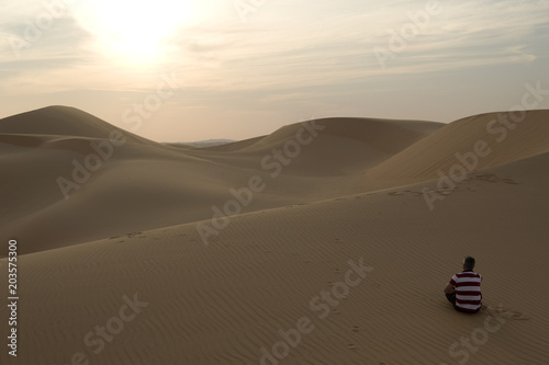 Walking on a sand dune