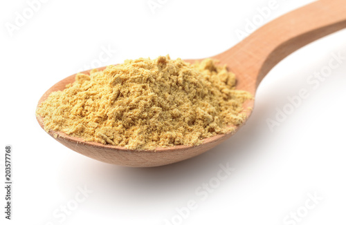 Wooden spoon with mustard powder © Coprid