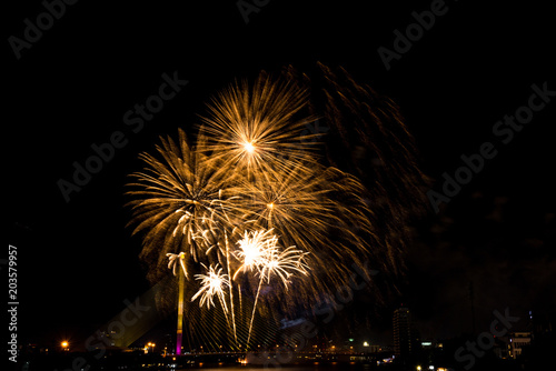 Beautiful golden firework display for celebration happy new year and merry christmas in the night sky, bangkok city, thailand