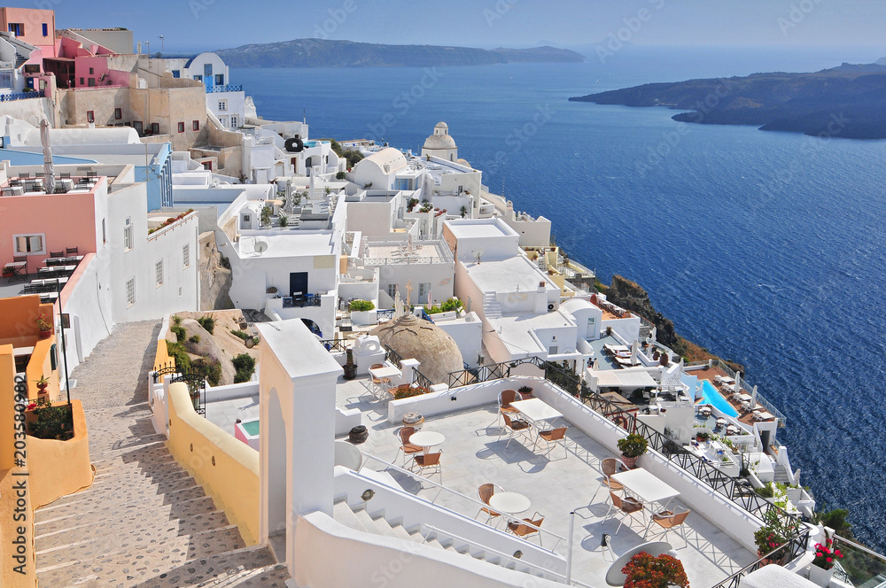 Afternoon view over town and ocean at Fira Thira Santorini Island Greece.