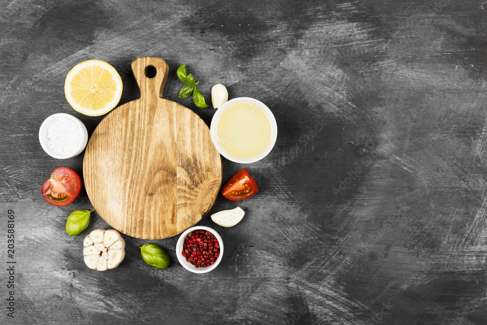 Various spices, herbs and vegetables on dark background. Top view, copy space. Food background Various spices, herbs and vegetables on dark background. Top view, copy space. Food background