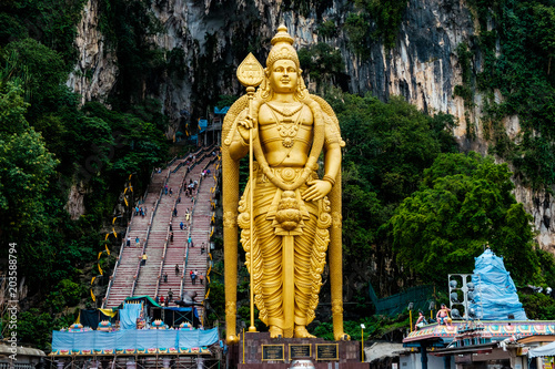huge gold statue of hindu god hanuman at entrance of batu caves during cloudy day in kuala lumpur malaysiahuge blue statue of hindu god hanuman at batu caves in kuala lumpur malaysia