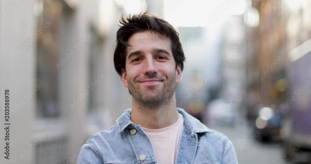 Portrait of young adult male on street