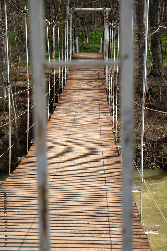 Suspended wooden bridge. the passage is closed on the bridge.