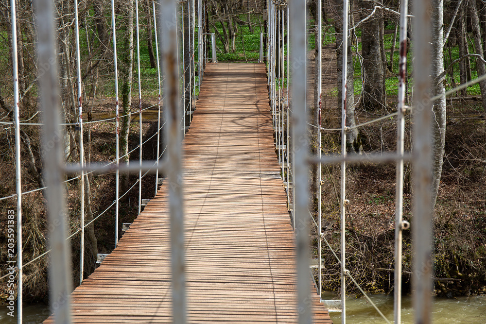 Suspended wooden bridge. the passage is closed on the bridge.