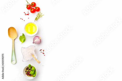 Ingredients for cooking, tomatoes and oil in dish, spices herbs and organic vegetables on a trendy quadruple white plate, healthy food and diet concept, Top view copy space