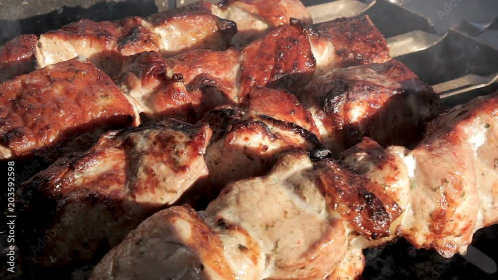 Roast beef kebabs on BBQ grill. Marinate shashlyk preparing on barbecue. Appetizing shish kebab on skewers. Roast beef kebabs on BBQ grill. Marinate shashlyk preparing on barbecue. Appetizing shish kebab on skewers.