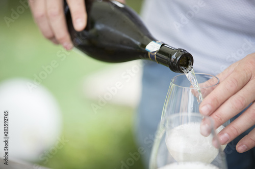 pouring sparkling wine