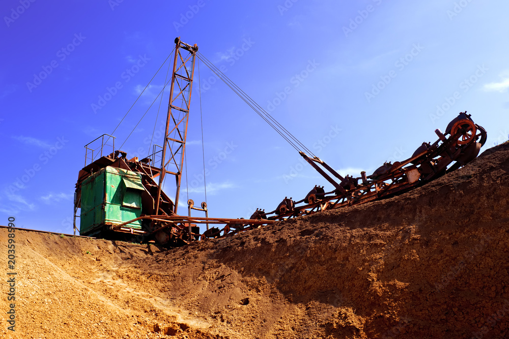 old bucket excavator of transverse dripping conducts the development of a quarry and extraction of clay old bucket excavator of transverse dripping conducts the development of a quarry and extraction of clay
