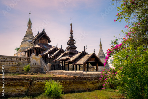 Beautiful view of ancient temple in old Bagan with flowers foreground