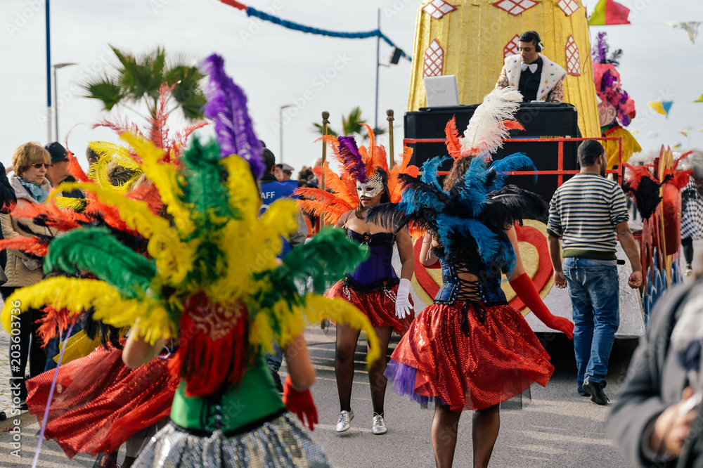 Dancers in costumes performing at the Carnival Parade on outdoors background