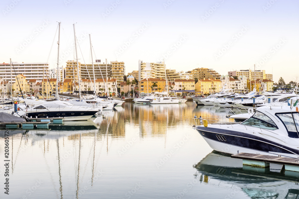 Marina with luxurious yachts and sailboats in touristic Vilamoura, Algarve, Portugal