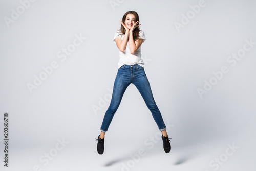 Joy fun enjoy funny crazy mad funky chill positive lifestyle person concept. Full-size view of excited cheerful delight rejoicing pretty woman jumping up isolated on gray background
