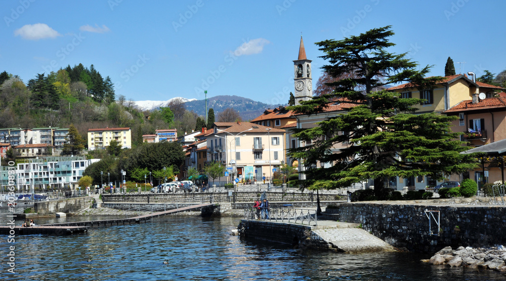 Obraz premium Laveno Mombello, Italy - April 18, 2018: Laveno Mombello, located in an natural gulf of Lake Maggiore in province of Varese, Italy.