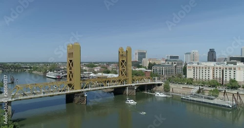 low level flight toward tower bridge in old sacramento photo