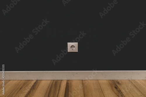 Photography Single power socket in dark wall over wooden floor