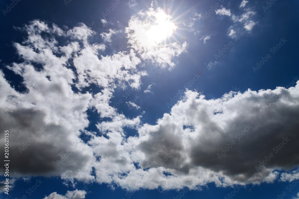 Fototapeta premium Nature weather, dramatic blue sky with clouds and sun rays