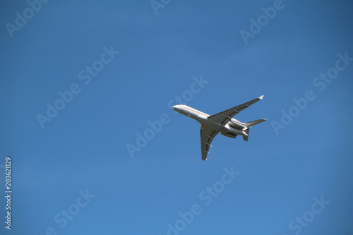 Airplane in clear blue sky