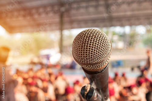 Old Microphones on stand in abstract blurred of speech in scout camp, speaking light for presentation in camps boy students Background. photo