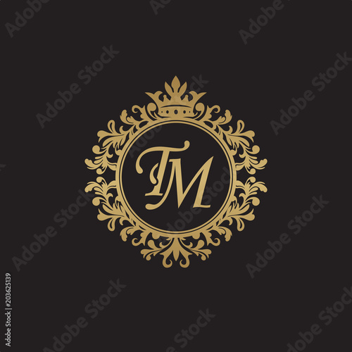Initial letter TM, overlapping monogram logo, decorative ornament badge, elegant luxury golden color