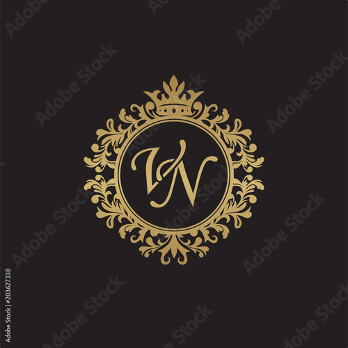 Initial letter VN, overlapping monogram logo, decorative ornament badge, elegant luxury golden color photo