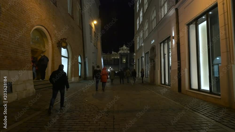 People walking on Sienna street in Krakow People walking on Sienna street in Krakow