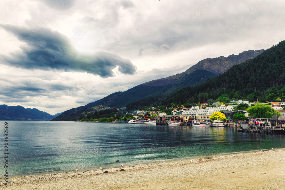 Lake Wakatipu coast view on a cloudy day in Queenstown, New Zealand