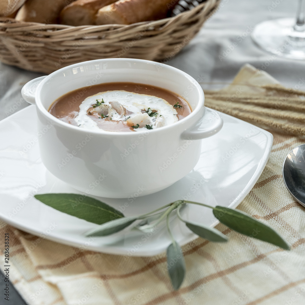Vegetable cream soup with shrimps in bowl on table Vegetable cream soup with shrimps in bowl on table