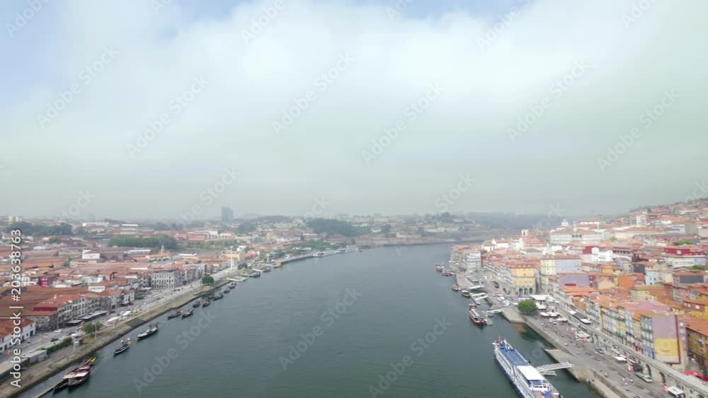 Top view of Douro river, Porto and Vila Nova de Gaia embankments from the Dom Luís I Bridge, Portugal Top view of Douro river, Porto and Vila Nova de Gaia embankments from the Dom Luís I Bridge, Portugal