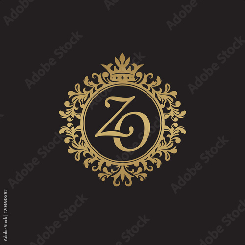 Initial letter ZO, overlapping monogram logo, decorative ornament badge, elegant luxury golden color
