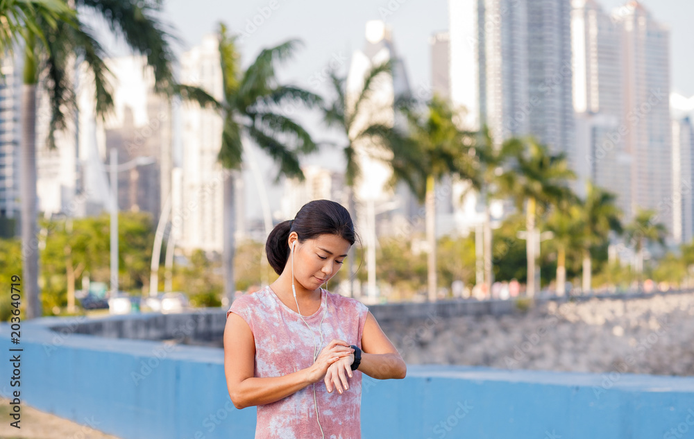 Asian female runner on running track. Individual sports concept