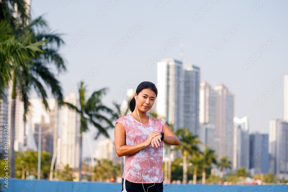 Asian female runner on running track. Individual sports concept