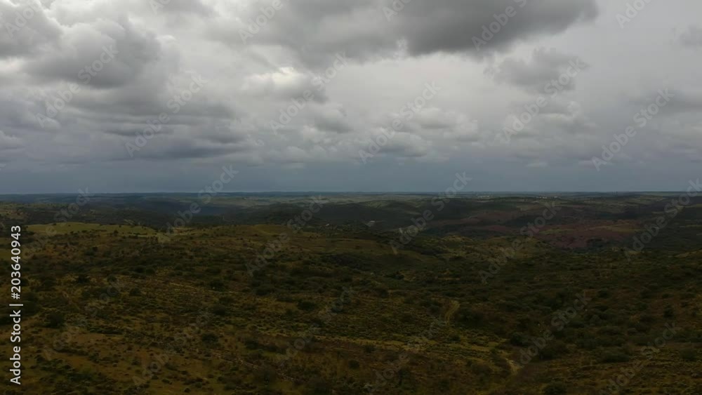 Aerial view over the agricultural fields with stormy weather in background. Alentejo Portugal Aerial view over the agricultural fields with stormy weather in background. Alentejo Portugal