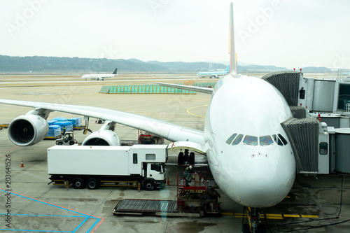 Front angle view of airplane on gate terminal s