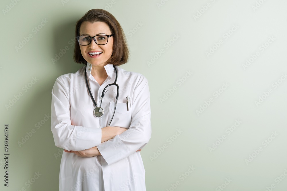 Positive middle-aged woman doctor Positive middle-aged woman doctor