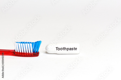 Toothbrush and toothpaste isolated on a white background