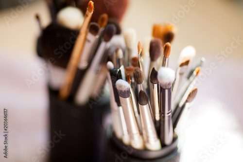 Various makeup brushes, closeup photo.