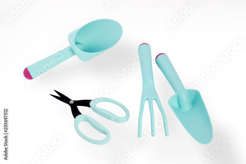 Fototapeta Naklejka Na Ścianę i Meble -  set of garden accessories - scoop, scissors for pruning plants, rake isolated on white