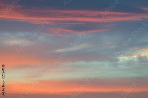 Nature background of vibrant colorful sunset clouds