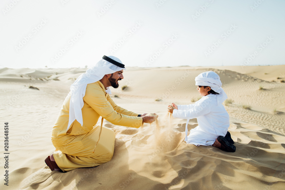 Fototapeta premium father and son spending time in the desert