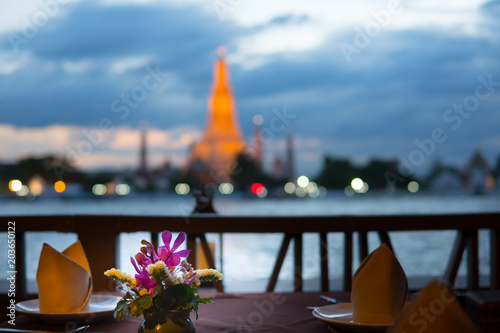 Photography Blured background fine dinning  resterant with blured Wat Arun Temple in Bangkok