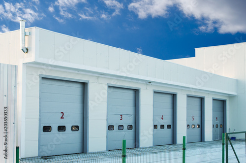 car repair station against a sky with clouds