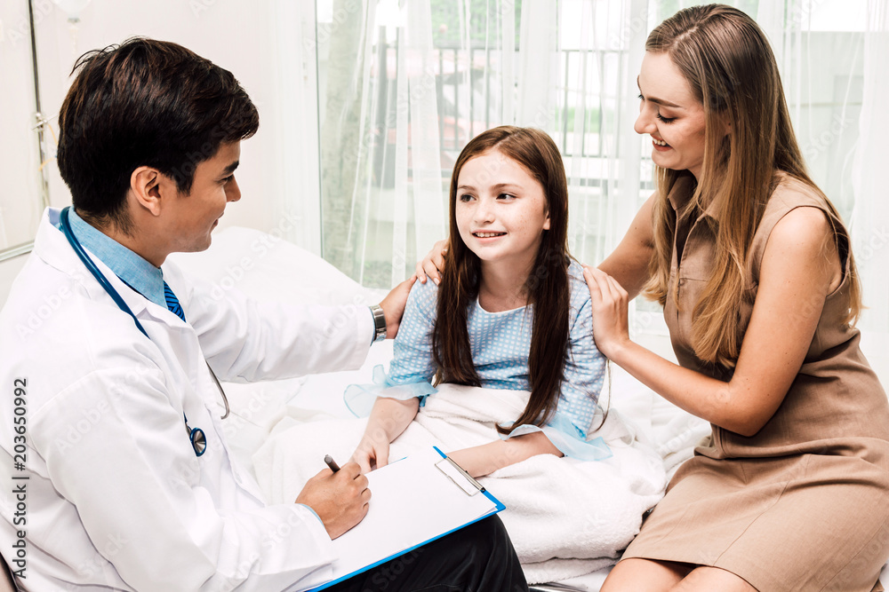 Doctor consulting and check up information with little girl and mom in hospital.A little girl has sick.healthcare and medicine Doctor consulting and check up information with little girl and mom in hospital.A little girl has sick.healthcare and medicine