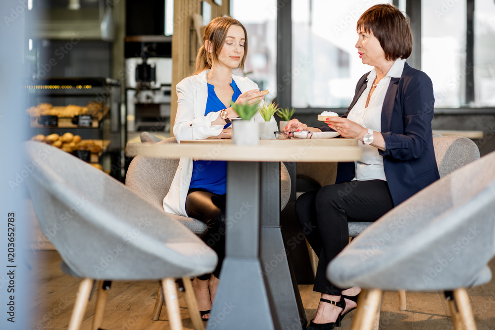 Business women during a coffee time in the cafe Business women during a coffee time in the cafe