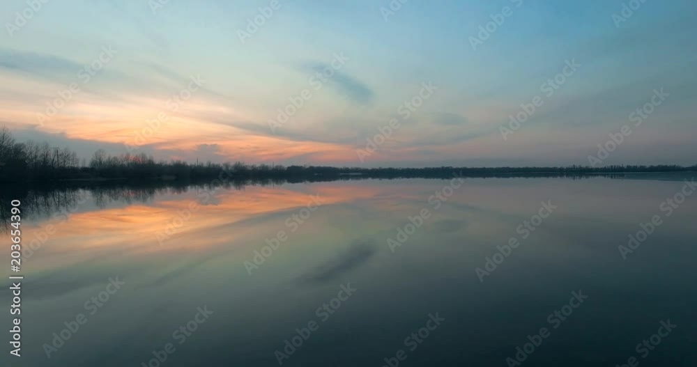 Aerial view dusk river. Golden and bleu hour sunset over the river Drone view over the golden sunset Beautiful Sunset Aerial Shot Fly over the river and sunset reys over the trees and branches Aerial view dusk river. Golden and bleu hour sunset over the river Drone view over the golden sunset Beautiful Sunset Aerial Shot Fly over the river and sunset reys over the trees and branches